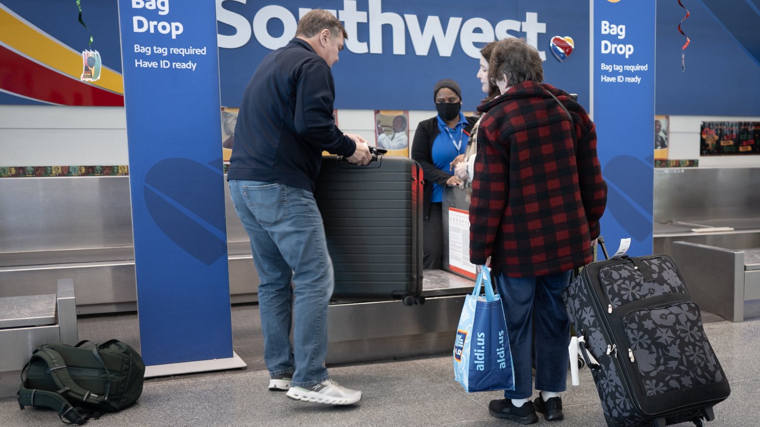 Passengers check in for Southwest Airlines flights at Chicago Midway International Airport on February 18, 2025 in Chicago, Illinois. The airline said it plans to layoff 1,750 employees, marking the first broad layoffs in the company's history.