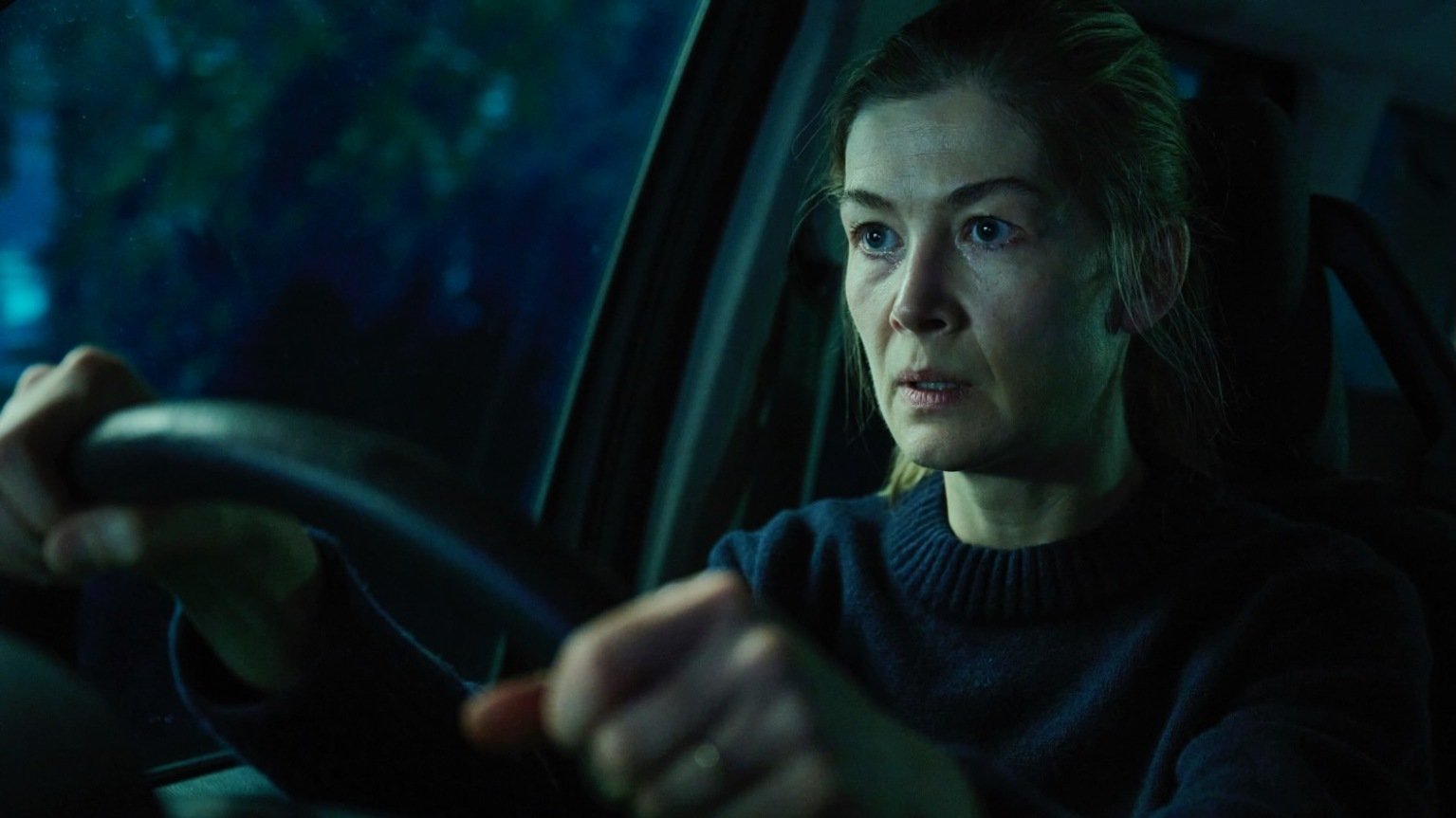 Rosamund Pike is behind the wheel of the car-set thriller "Hallow Road." 