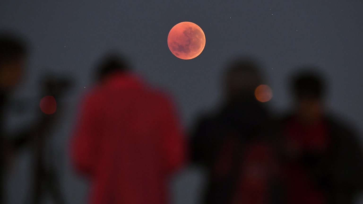 People witnessing a total lunar eclipse in Melbourne, Australia on July 28, 2018.