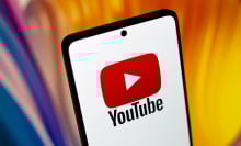 YouTube logo on a smartphone.