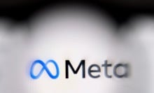 The Meta logo on a blurred computer screen.
