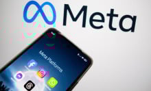 An image of Meta's logo with a phone displaying different Meta company apps. 