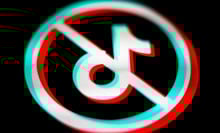 The TikTok logo within a circle and a line crossed through it.