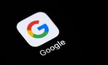 google app on a black screen of a smartphone