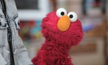 elmo staring at a camera