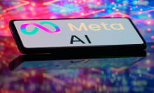 A phone displays a Meta AI logo in front of a glowing, multi-colored background.