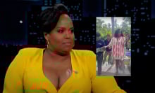 A woman sits on a talk show sofa. Beside her is another image of the same woman touching a lizard.