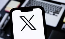 In this photo illustration, a X (Twitter) logo is seen displayed on a smartphone.