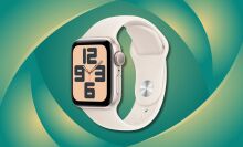 a starlight colored apple watch se 2 against a green and yellow patterned background