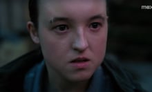 A close-up of a young woman's face looking angry.