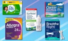 several allergy medicines on a blue background including puffs tissues, allegra pills, bausch and lomb eye drops, and breathe right strips