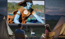 couple watching Portable Projector with avatar 2 on screen