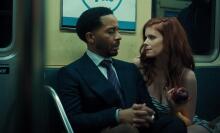 Lula (Kate Mara) offers an apple to Clay (André Holland) during an unexpected encounter on a New York subway train in this scene from "The Dutchman."