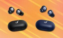 the anker space a40 earbuds in both black and blue on an orange background