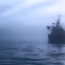 A ship amid the fog in the ocean