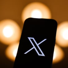 X logo on mobile device