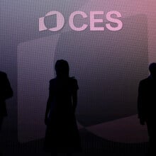Silhouettes of CES attendees in front of a purple backdrop. 