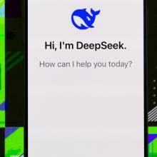 DeepSeek homepage on a smartphone against a neon green background