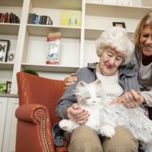 A woman and her caretaker bond with a robotic pet.