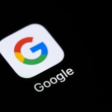 google app on a black screen of a smartphone