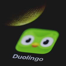 the duolingo app being pressed on a phone