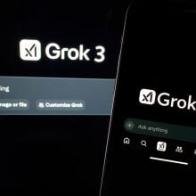 grok 3 app on a smartphone in front of a computer screen showing the grok 3 interface.