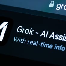 A zoomed-in photo of the Grok AI Assistant desktop page. 