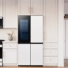 a kitchen and laundry room with samsung appliances and white cabinetry