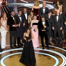 The cast and crew of "Anora" accept Best Picture.