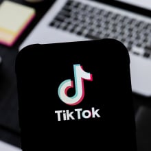 A TikTok logo seen displayed on a smartphone.