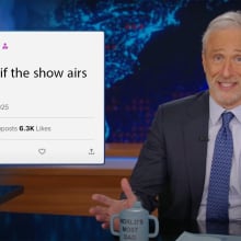 A man in a suit sits behind a talk show desk. In the top left is an image of an X post from Elon Musk.