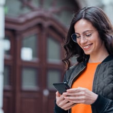 Person looking at phone smiling