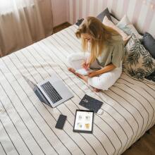 Girl on bed with laptop