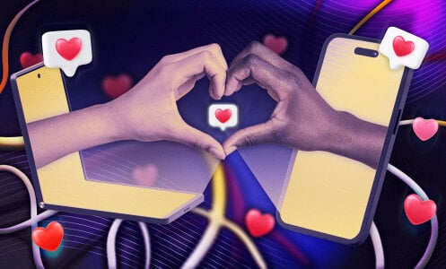 two hands reaching out of laptops to form a hand heart