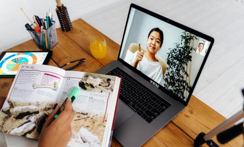 Notes and laptop on desk