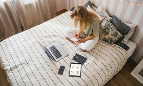 Girl on bed with laptop