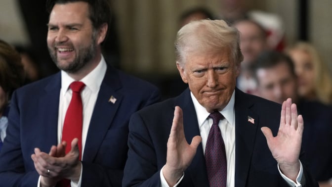 US Vice President JD Vance applauds US President Donald Trump after he was sworn in as the 47th US President