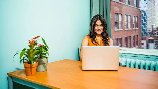 Girl using laptop at desk