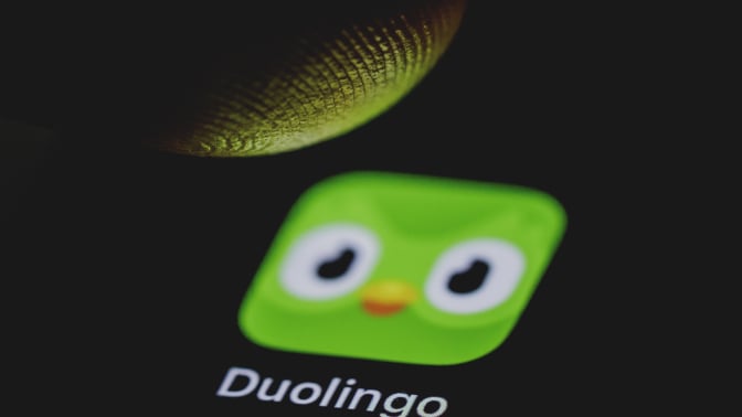 the duolingo app being pressed on a phone
