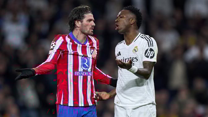 Vinicius Junior of Real Madrid CF argues with Rodrigo de Paul
