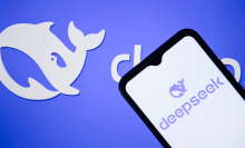 The DeepSeek logo is seen displayed on a mobile phone screen. 