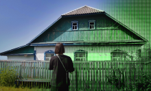 a woman standing in front of a composite of a digitized house