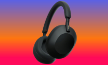 Sony WH-1000XM5 on a blue to red background