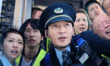Passengers and a train conductor in 'Bullet Train Explosion.'