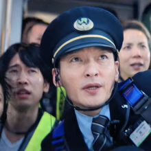 Passengers and a train conductor in 'Bullet Train Explosion.'